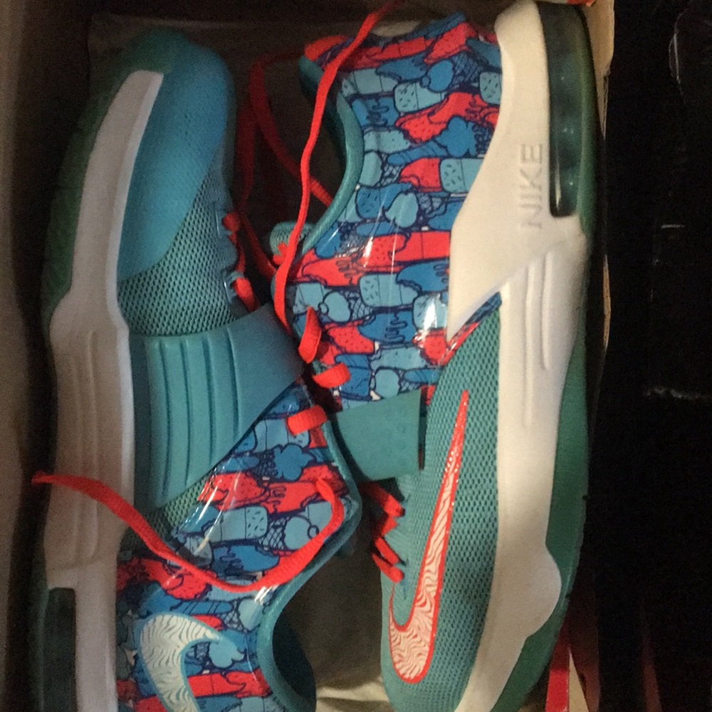 Orange and blue Nike 5